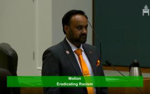 Tanzil Rahman giving a speech