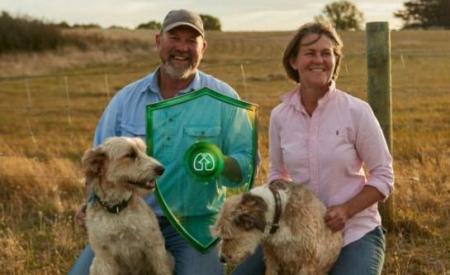 farmer couple with their dogs